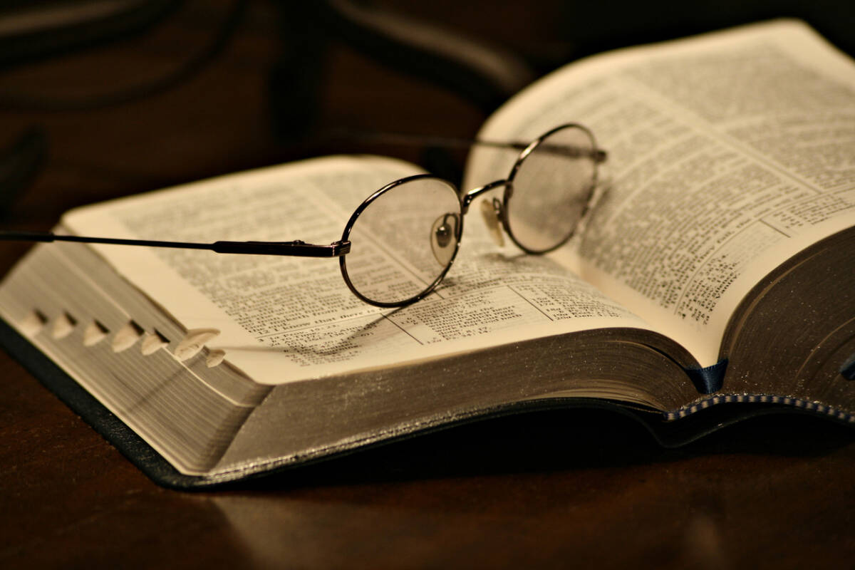 The Bible open to Ecclesiastes Chapter 3 verses 1-22, For every thing there is a season and a time.