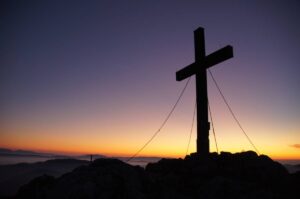 photo of a sunset and a cross