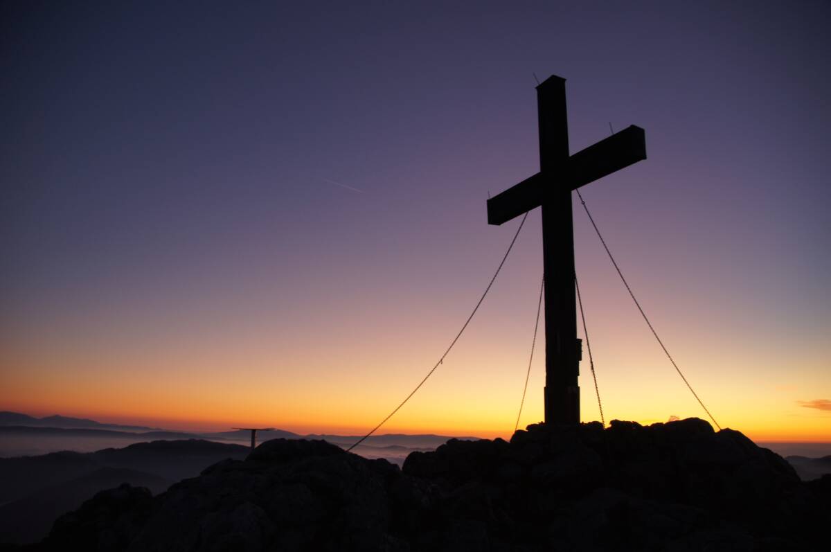 photo of a sunset and a cross